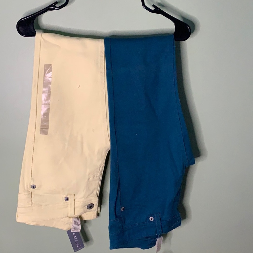 Yellow and green pairs of jeans